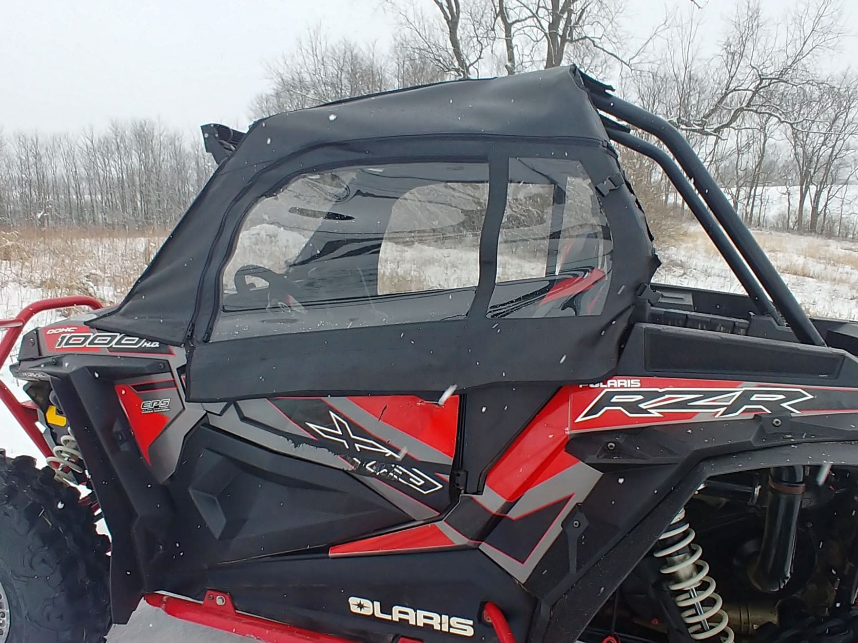 Red and black Polaris RZR side-by-side UTV