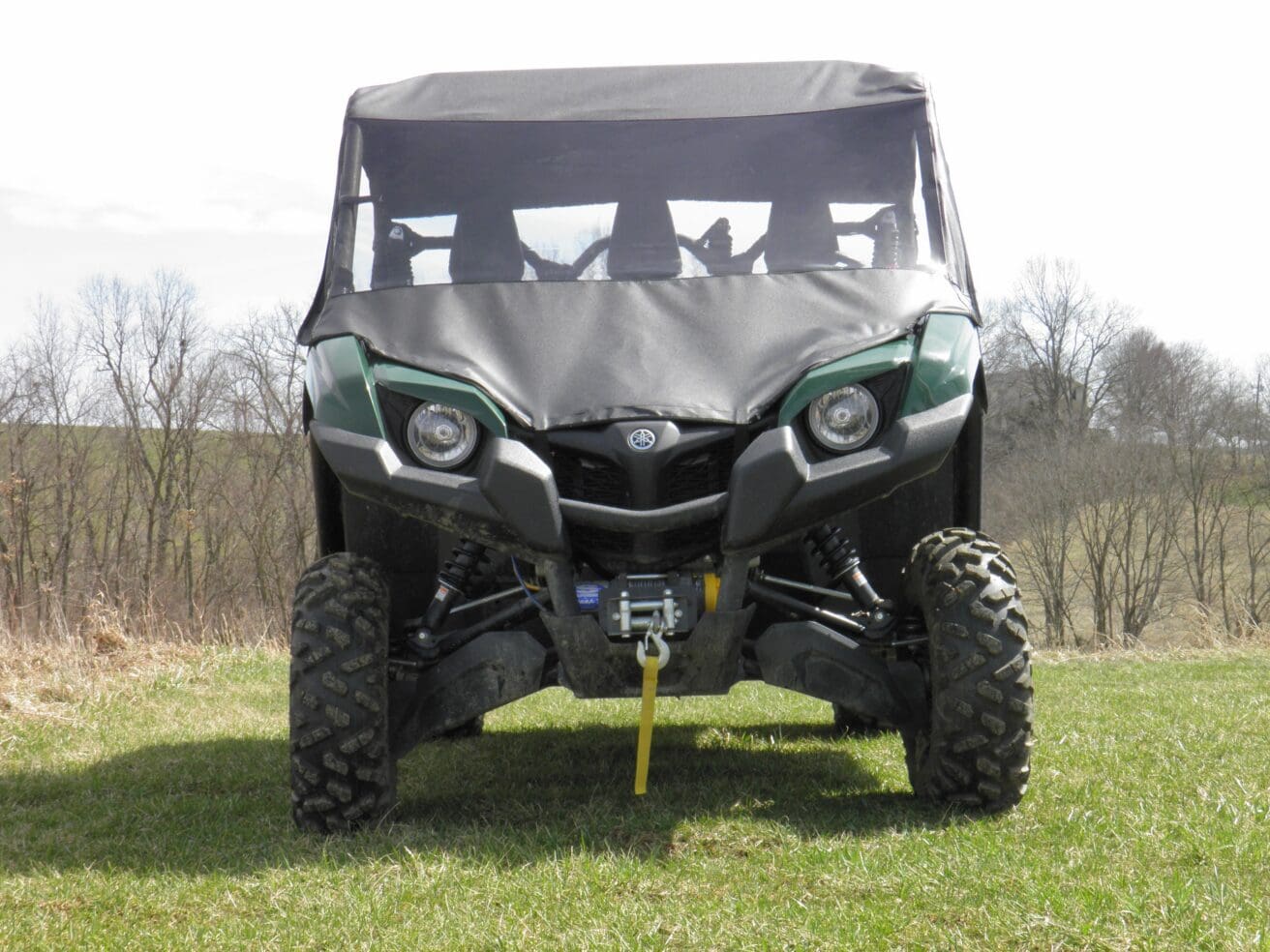 Front view green UTV with canopy and winch