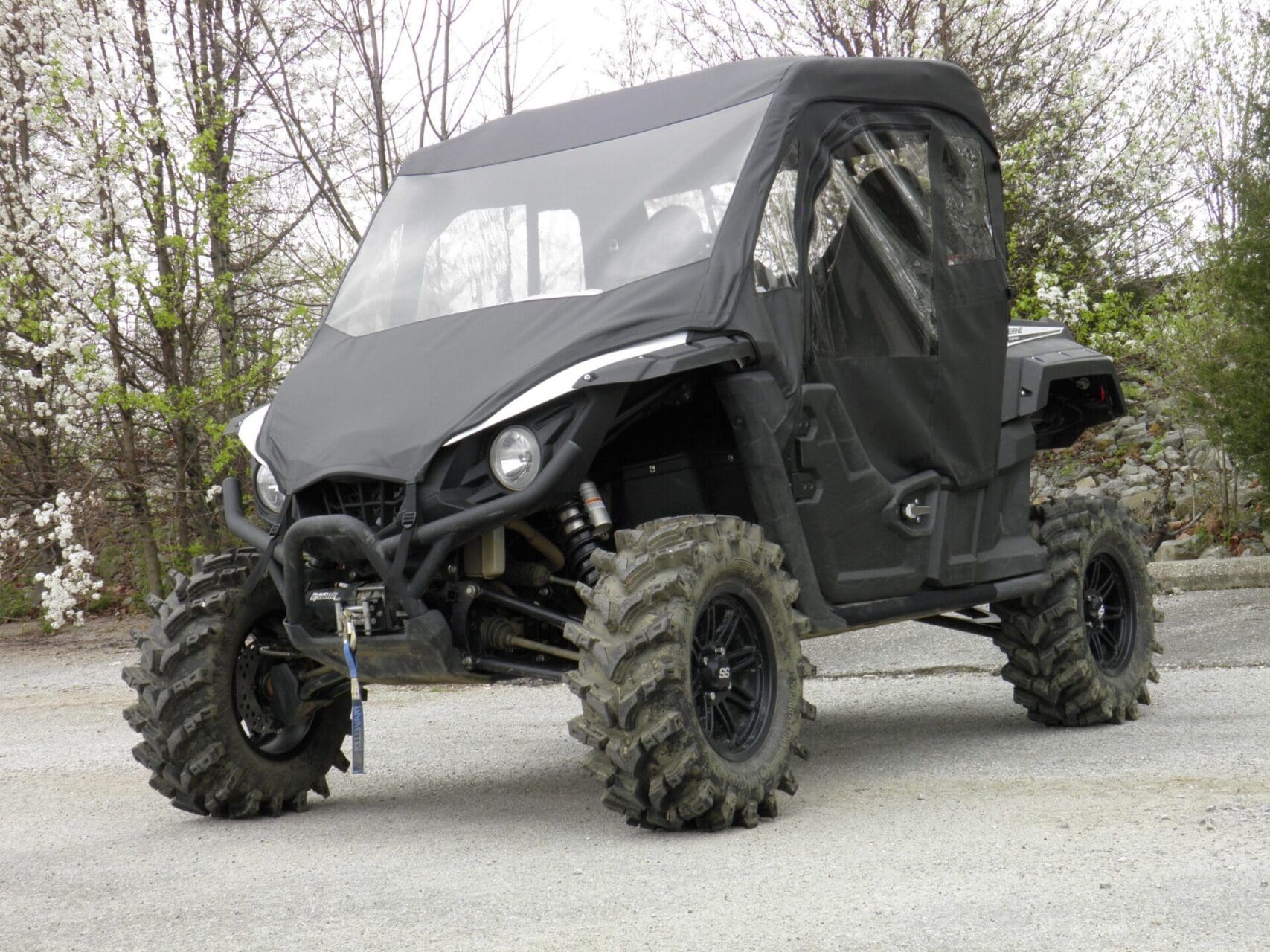 Black UTV with enclosure and winch